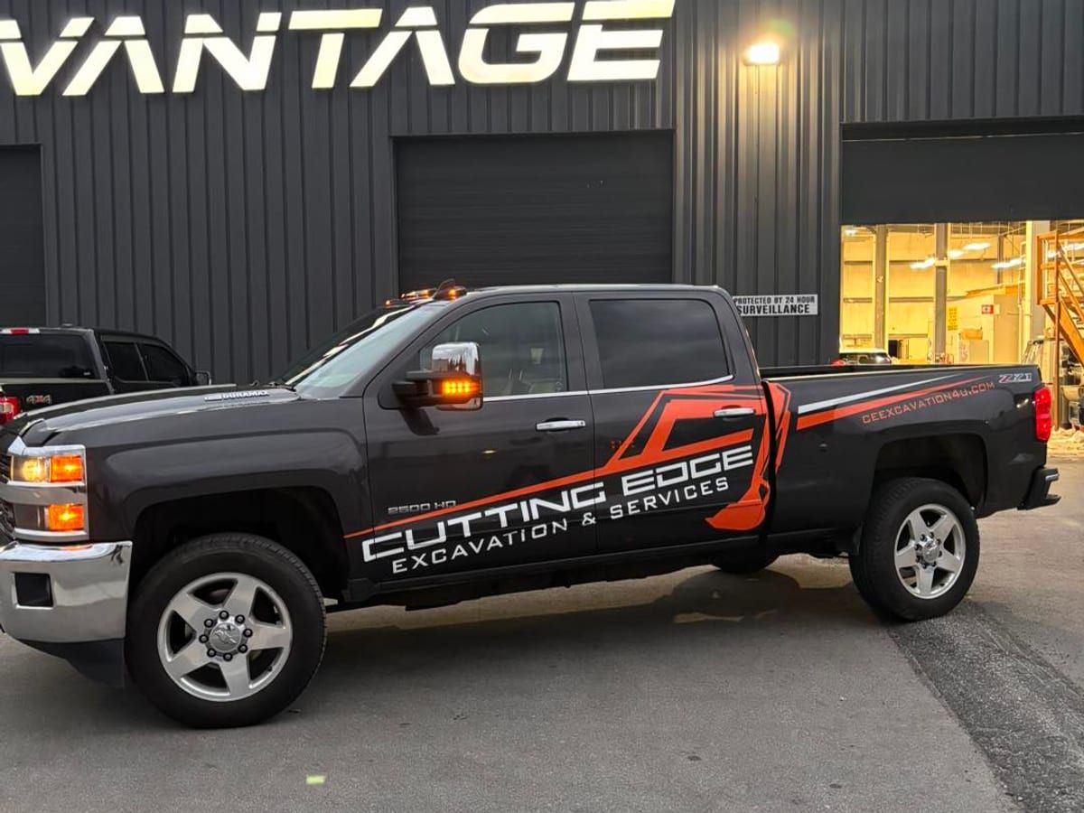 Wrapped Cutting Edge pickup truck outside the vinyl shop after its wrap